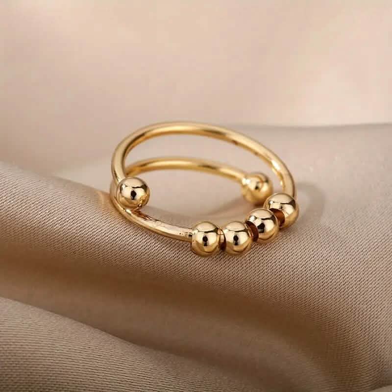 18K Gold drehbare Perlen Angst-Ring