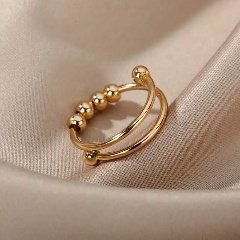 18K Gold drehbare Perlen Angst-Ring