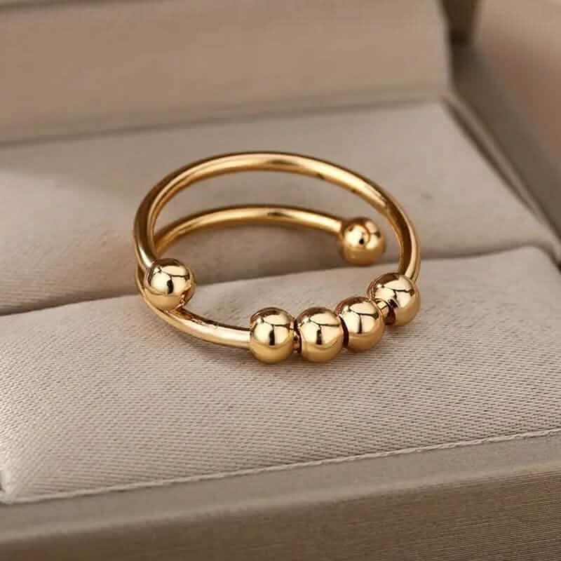 18K Gold drehbare Perlen Angst-Ring