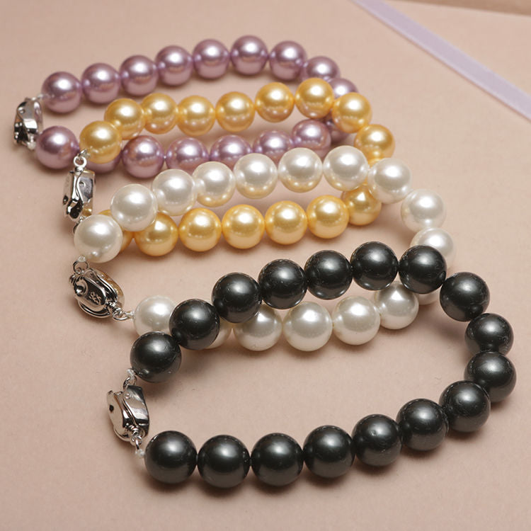 Elastisches Armband mit Perlmuttperlen