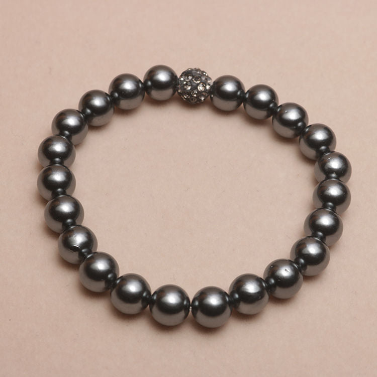 Elastisches Armband mit Perlmuttperlen