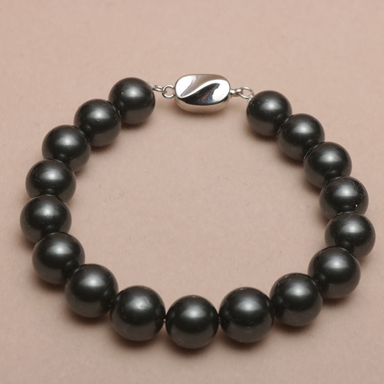 Elastisches Armband mit Perlmuttperlen