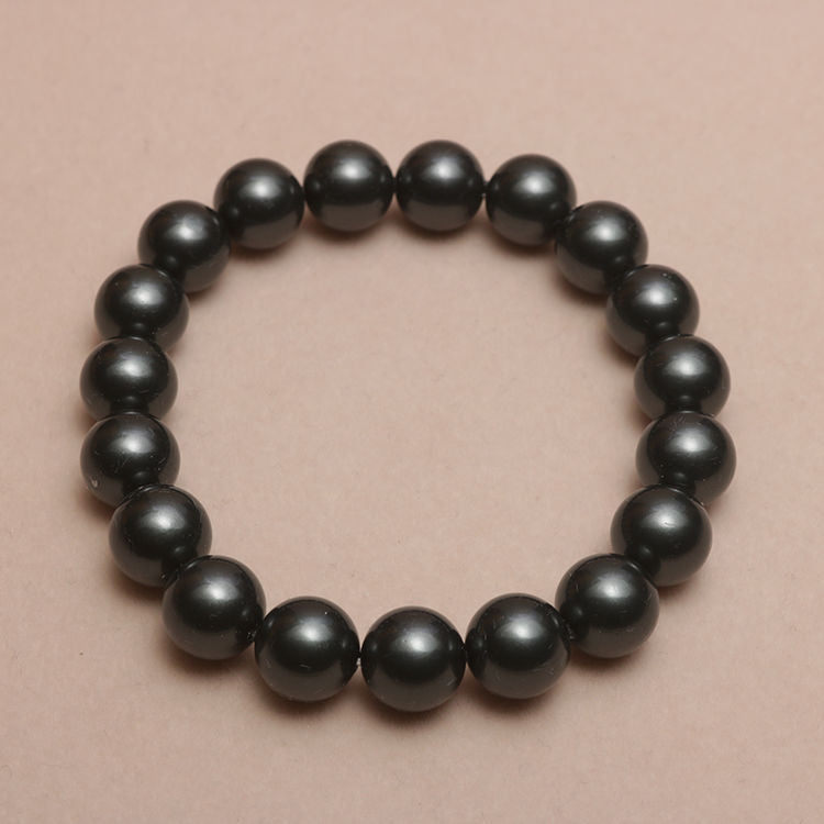 Elastisches Armband mit Perlmuttperlen