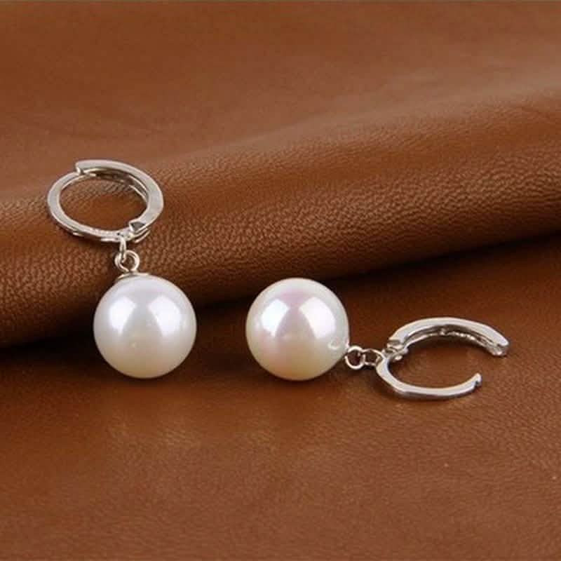 Ohrringe aus Sterlingsilber mit Diamantschliff-Perle